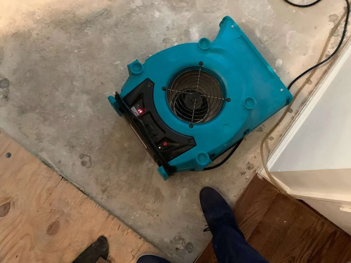 Air mover drying subfloor during Leak Detection & Repair in Fort Polk South